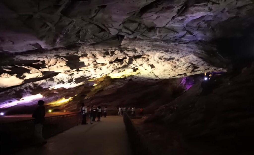 People enjoying the inside view of borra cave